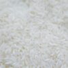 A detailed close-up shot of uncooked white rice grains, emphasizing texture and natural quality.